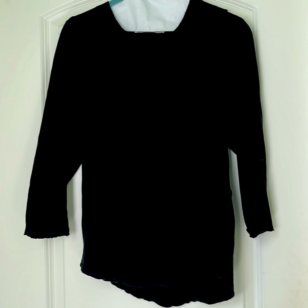 Medium Black raglan tee with stitching detail on neck and curved hem.